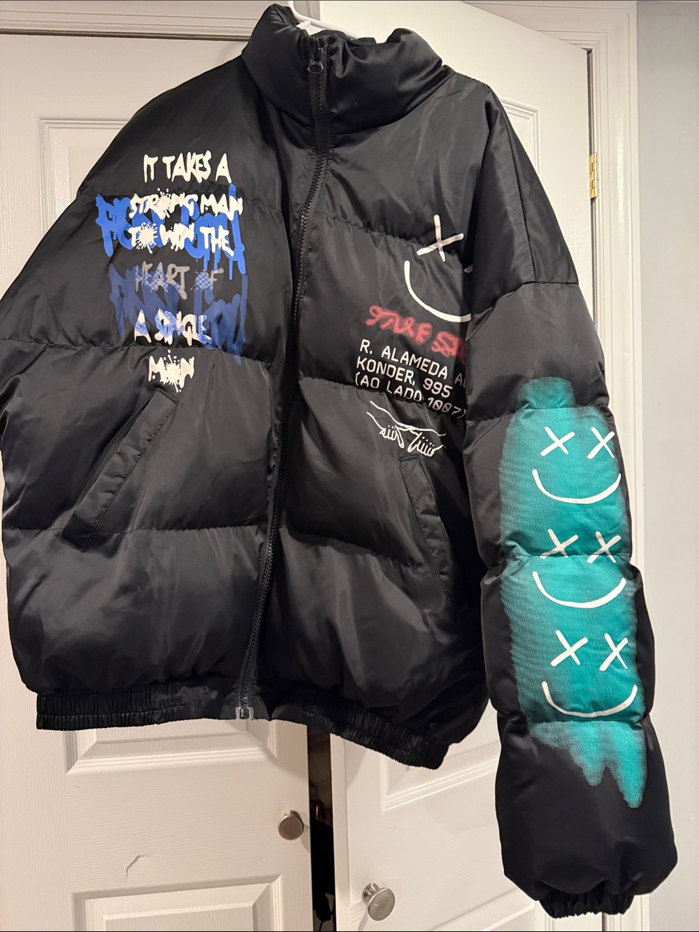 Men’s Black Graphic Puffer Jacket with Teal Smiley Sleeve